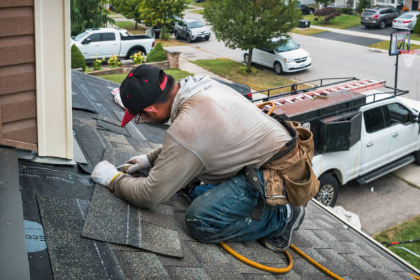 Professional Roof Replacement technician working in East Kingston, NH